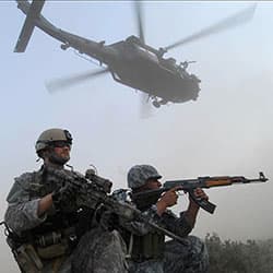 A Special Forces soldier and his Iraqi counterpart prepare to raid a suspected Al Qaeda in Iraq location in September 2008.