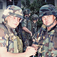 Captain (CPT) Robert T. Davis, 528th SOSB Operations Officer, pauses for a photo with Sergeant First Class (SFC) James E. Boone, shortly after arriving in Panama.