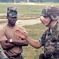 528th Commander, Lieutenant Colonel David L. Shaw, meets the FARP team at Howard Air Force Base in late December, 1989. Staff Sergeant Sammie L. Mitchell (center-left), the team’s leader, listens intently.