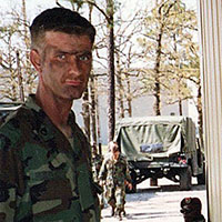 (L-R) Sergeant First Class (SFC) Robert Malton and Captain (CPT) James S. ‘Steve’ Kestner, Company A, 112th Signal Battalion, conduct sustained airborne training at ‘Green Ramp,’ Pope Air Force Base, North Carolina, December 1989. Their jump that day was ultimately cancelled due to U.S. Air Force repositioning of aircraft for the impending invasion of Panama (Operation JUST CAUSE). By 20 December 1989, the two men were on their way to Panama to ‘plus up’ 112th Signal Battalion signal support to SOCSOUTH. (Photo courtesy of James S. Kestner)