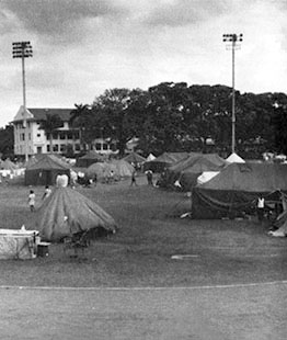 The CA team scrounged unserviceable parachutes for sun shelters.