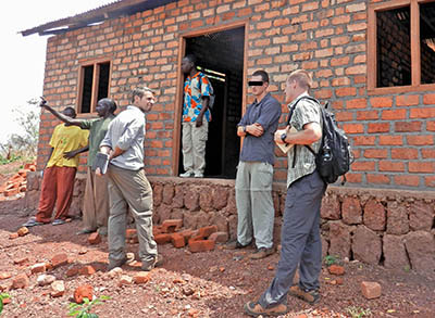 Matthew Brubaker, the local ODA commander, and CPT Vance inspect Radio Zereda in Obo to see how they can help with improvements.