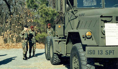 BG Wayne A. Downing, Deputy Commanding General, 1st SOCOM, discusses the SOSB’s transportation mission with SPC Marcus L. Luckey and 1LT Pack.