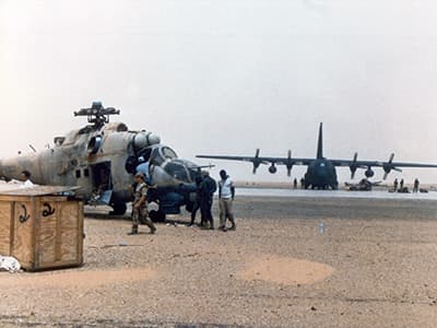 The Hind in the process of being prepped at Ouadi Doum. The C-130 was there to transport the Hind’s rotor blades and the discarded internal fuel tanks from the Chinooks.