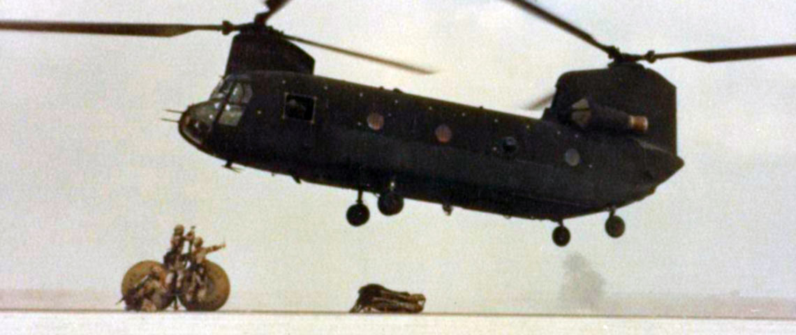 528th Special Operations Support Battalion soldiers near Dammam, Saudi Arabia, prepare to sling-load 500-gallon water blivets under a CH-47 helicopter, for transport to forward-located Special Operations Forces locations.