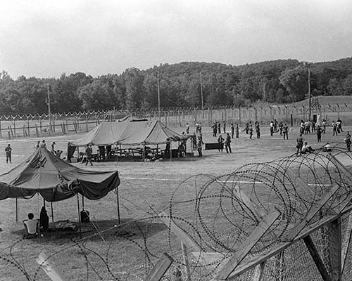 The USAR 13th POB was the only PSYOP unit with the Enemy Prisoner of War (EPW) mission. Here, 13th POB soldiers conduct annual training at a mock EPW camp, which it did routinely prior to 1990. Training exercises like this helped it prepare for real-world operations during the Persian Gulf War.