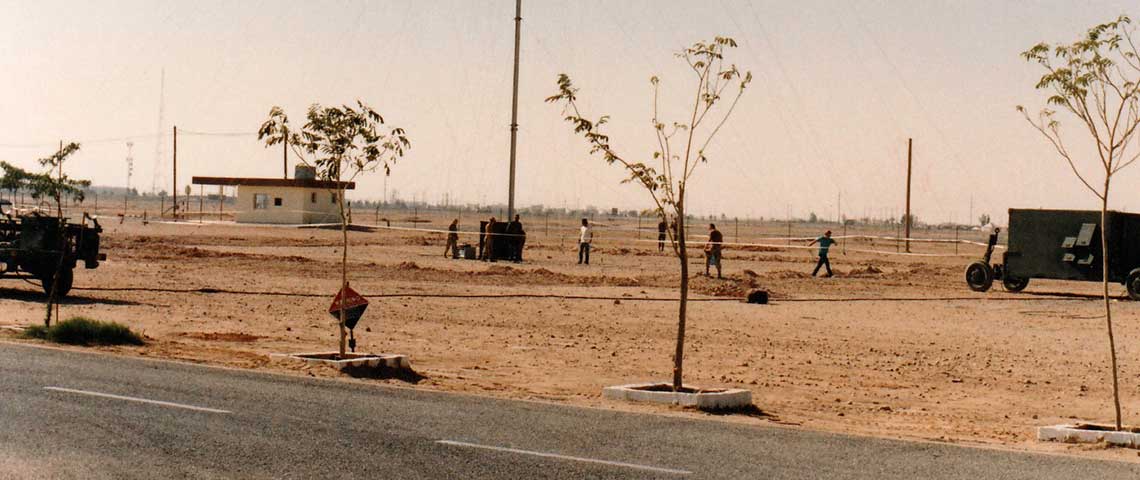 The 125-foot antenna and transmitter shelter (right) for the TAMT-10 at Al Qaisumah, Saudi Arabia, December 1990.