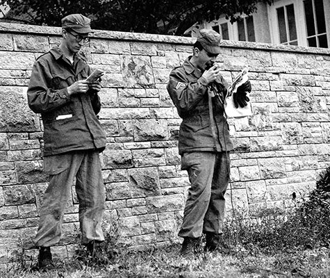 CPL Boris A. Niepritzky (right) making a loudspeaker broadcast in Russian during maneuvers, 1952.