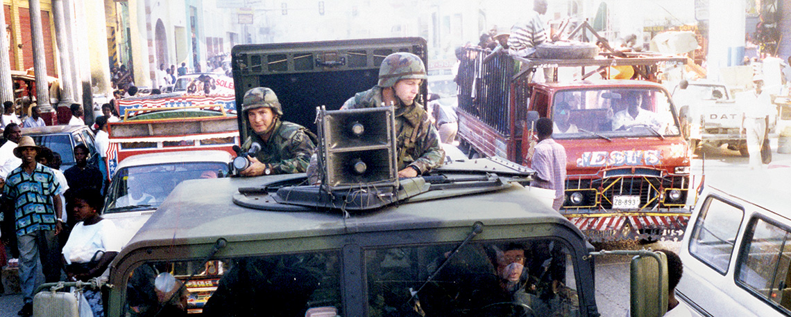 Two TPTs distribute printed materials and radios around Port-au-Prince