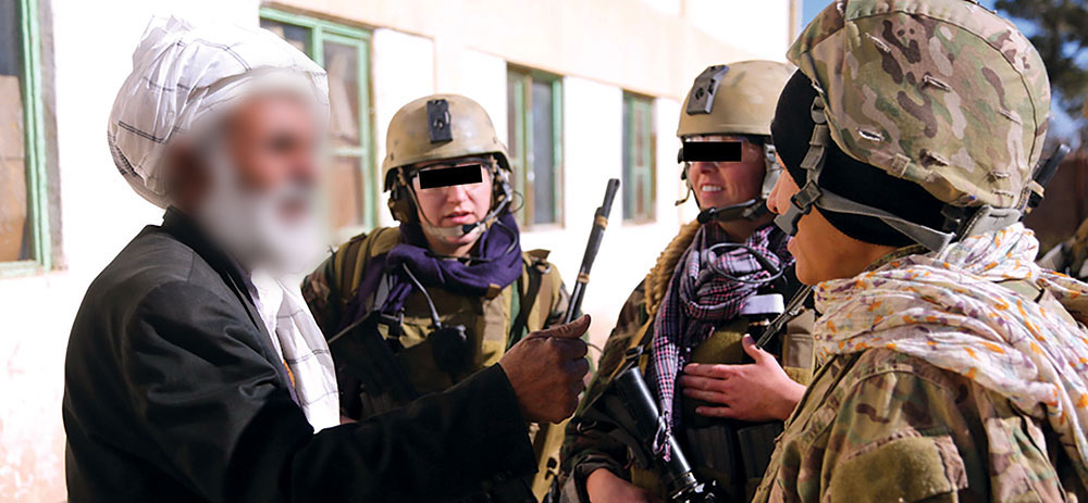 Members of the 4th Special Operations Kandak (SOK), Afghan National Army, and CST-6 distribute supplies to support a local school