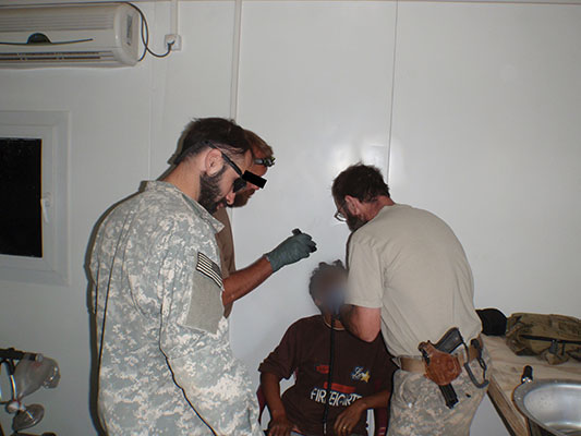 SF medic assisting SFG Dentist