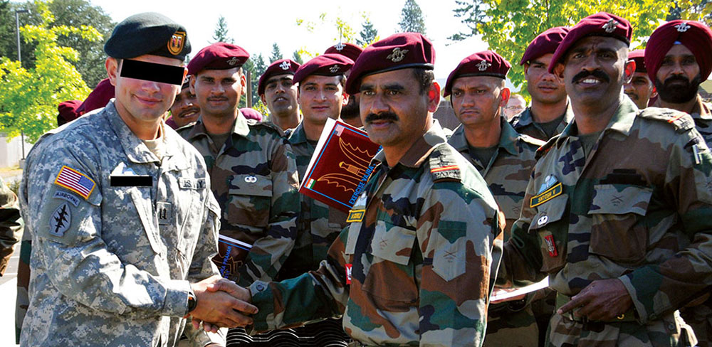 ODA 1412 commander CPT Jimmy M. Townshend* mingles with PARA (SF) personnel following the 25 August 2011 closing ceremony.