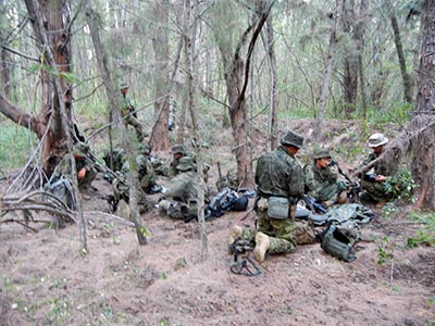 Once the two teams linked up, they established a hide site. From there, they conducted patrols to determine the location and size of the 'enemy' force