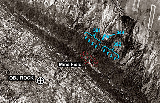 ODAs 391, 392, and 044B accompanied Peshmerga soldiers as they advanced over Dog Ridge toward Objective Rock. The Peshmerga cleared a mine field and insisted that the Americans follow the road over the ridge.