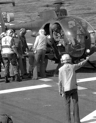 Chief Warrant Officer 4 James Dietderich and Warrant Officer Mike Gwinn made three round trips to the USS Guam ferrying wounded out to the ship.