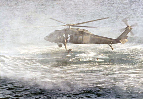 Crews of the 129th training with members of 7th Special Forces Group helocasting in Panama.