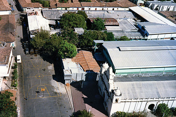 The old DM-4 cuartel in San Francisco de Gotera “butted up” against the Catholic church in the town center. Note the basketball court painted on the street outside the main gate.