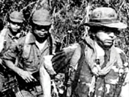 Lieutenant Colonel Domingo Monterrosa, former commander of BIRI Atlacatl (in the lead), took command of the 3rd Brigade in December 1983. The third soldier in line was Monterrosa’s body guard, Soldado Juan Antonio Gómez.