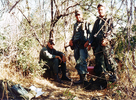 Sergeant David Janicki, Staff Sergeant Peter Moosey, and Sergeant Kenneth Beko at an FMLN campsite whose occupants received an early “wake up call” from a  Cazador range clearing patrol.