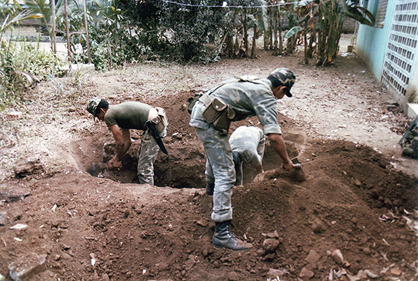 The primary digging tool for the ground defensive positions was the U.S. Army folding entrenching tool. The rock-hard dirt was used to fill the sandbag barriers in front of each position.