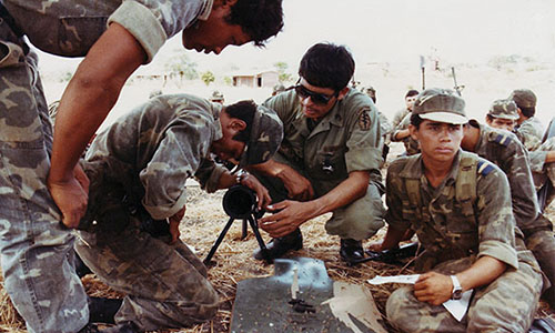Sergeant First Class LeRoy Sena trains Ponce Cazadores on the 90mm recoilless rifle in El Salvador.