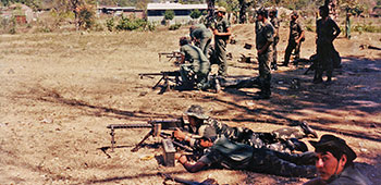 ODA-7 trains Salvadoran 3rd Brigade soldiers on the M-1919A6 light machinegun outside San Miguel.