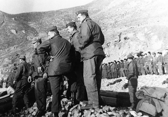 Major Jack Singlaub and JACK advisors observe training. From right to left, Major Dutch Kramer, Lieutenant Tom Curtis, Major John Singlaub and Lieutenant George Atcheson.