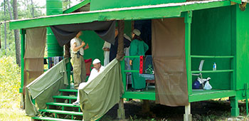 At the village mosque in Freedom Village role players relax between groups of students.