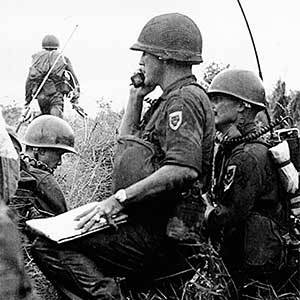 A U.S. advisor with the South Vietnamese Army Rangers. American advisors used the  man-pack PRC-10 FM  radios to call for  artillery, air support, and to communicate with their higher  headquarters early  in the war.