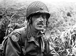 Colonel Robert T. Frederick, First Special Service Force commander, rests during operations on Kiska, 15 August 1943. The “Long Knives” patch of Amphibian Training Force 9 is on his right shoulder.