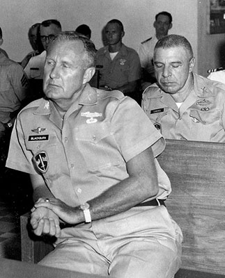 BG Donald D. Blackburn with COL Arthur D. “Bull” Simons seated behind him.