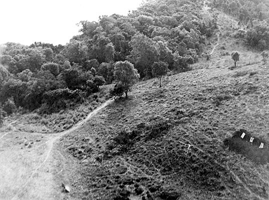 An OSS Area #1 headquarters in enemy-occupied territory as seen from the air. The firing range on the right was used to train indigenous recruits.