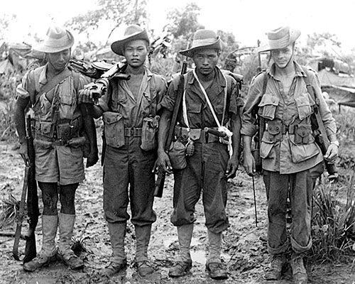 A group of Kachins with a parachute-qualified OSS officer somewhere in Burma 1944-45. 