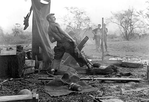 A Merrill’s Marauders mortar crew bombards Japanese positions in Myitkyina.