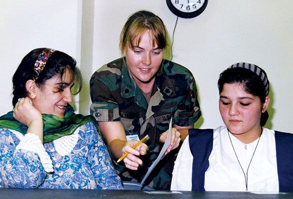 Specialist Four Sarah Williams teaching one of the ESL classes. Assigned to the 8th POB and deployed with the MIST, she had been a teacher before joining the Army. As the ESL program expanded more teachers were needed to meet the demand.