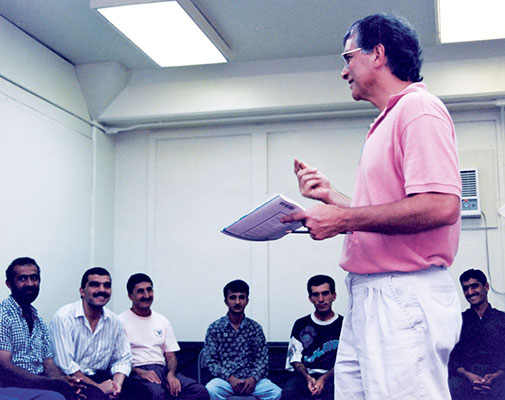 Dr. Joseph Arlinghaus shares a joke with his students while teaching an ESL class. Entezar and Arlinghaus were critical to getting the ESL program started during Operation PACIFIC HAVEN.