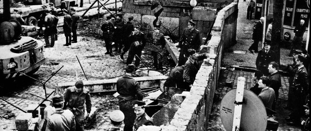 The Berlin Wall divided East and West Berlin for 28 years. Construction by the German Democratic Republic began on 13 August 1961. The Wall collapsed on 9 November 1989 to pave the way for German reunification.