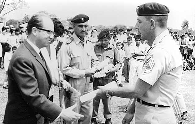 SFC Harold T. Carpenter receives his Diploma de Honor from Bolivian Vice President Adolfo Siles.