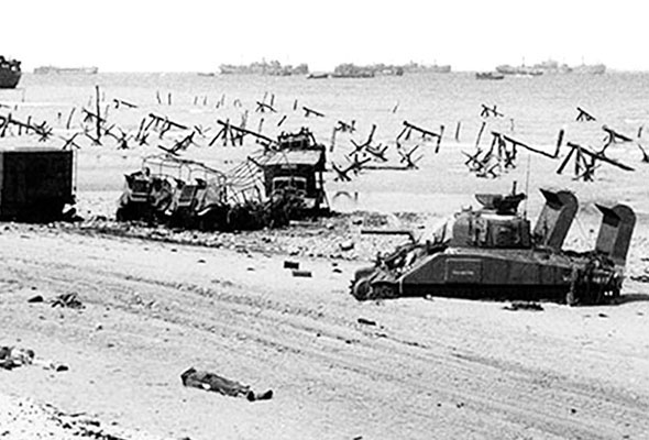 Specially modified deep water M-4 Sherman Tanks landed on D-Day to provide fire support for the infantry. Most never made it past the beach. They either flooded or were destroyed by the concentrated German fire. Mounted on the rear of the tank are two exhaust vents to allow the engine to run in the deep surf.