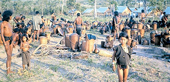 Villagers newly-arrived at a relocation camp were often confused and had only what they could carry with them.