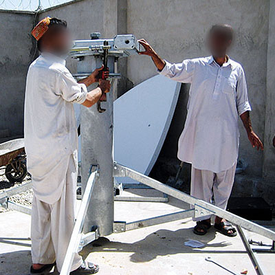 Afghan contractors assemble the cellular telephone tower. Bringing cell phone service to Deh Rawod was a major CA success.