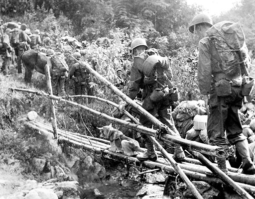 MARSmen move into an assembly area on 18 January 1945 before launching another attack on the Japanese.