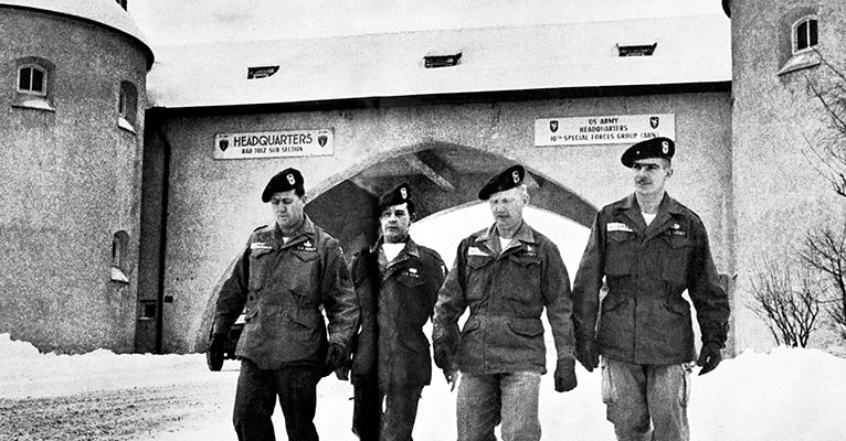 Soldiers assigned to the 10th Special Forces Group wear the unit’s Trojan Horse Badge just outside of the gates at Bad Tölz, Germany soon after the unit adopted the badge.