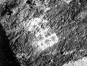 This CCF movement direction marker scratched into a rock could not be seen from the air.