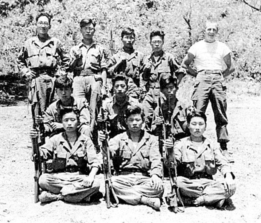 CPL Joseph Howard (right rear) poses with the first Korean graduates of ISF counter guerrilla training.