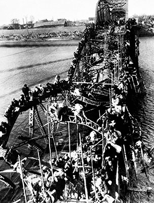 The impending Chinese invasion sent millions of North Koreans south. Refugees from P’yongyang streamed across the remains of the Taedong River Railroad Bridge, climbing twisted girders and balancing on broken railroad ties.