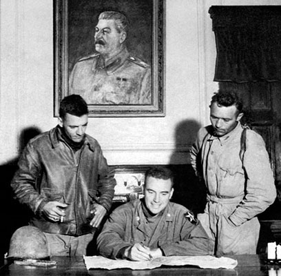 LTC Ralph Foster, seated at Kim Il Sung’s desk, and members of TF INDIANHEAD searched government offices in P’yongyang for documents and information regarding American POWs.