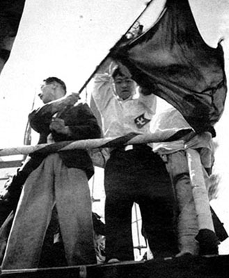 Communist leaders yelling “Banzai!” exhorted the confused crowd to fall in line for a march to the Imperial Palace, three miles away in central Tokyo.