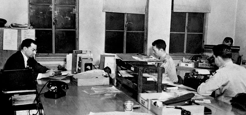 This photo shows the Voice of the UN Command (VUNC) News Section, 1st RB&L Group, in their area of the sixth floor, Empire House, Tokyo.
