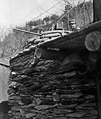 CPL Russell A. Shafer manning the .50 caliber machine gun mounted at the left front corner of the mess tent/armament bunker.